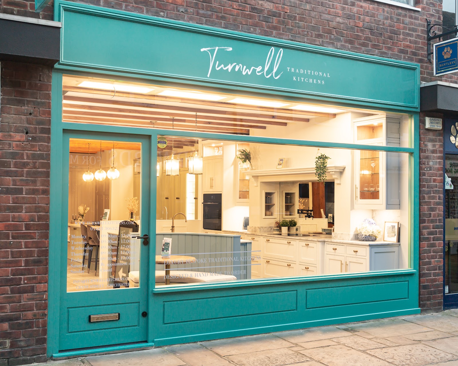 The Turnwell Kitchens showroom on Crane Street, Chichester — a full traditional kitchen display behind the window, designed and hand-made to order.